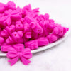 front view of a pile of 25mm Hot Pink Bow Knot silicone bead