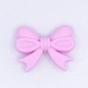 top view of a pile of 25mm Pink Bow Knot silicone bead