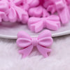 close up view of a pile of 25mm Pink Bow Knot silicone bead