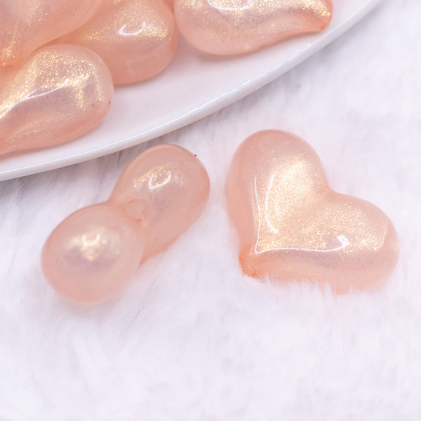 close up view of a pile of 28mm Champagne Pearl Heart Acrylic Bubblegum Beads