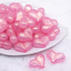 front view of a pile of 28mm Pink Glitter Pearl Heart Acrylic Bubblegum Beads