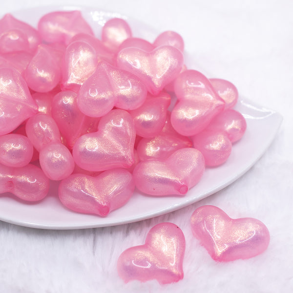front view of a pile of 28mm Pink Glitter Pearl Heart Acrylic Bubblegum Beads