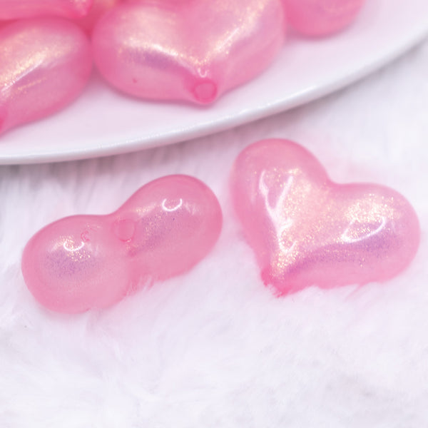 close up view of a pile of 28mm Pink Glitter Pearl Heart Acrylic Bubblegum Beads