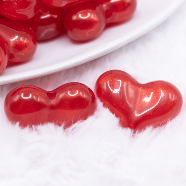 close up view of a pile of 28mm Red Glitter Pearl Heart Acrylic Bubblegum Beads