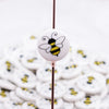 macro view of a pile of 25mm Bumble Bee Print Flat Disc Acrylic Bubblegum Beads - 10 Count