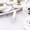 side view of a pile of 25mm Bumble Bee Print Flat Disc Acrylic Bubblegum Beads - 10 Count