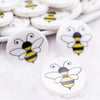 close up view of a pile of 25mm Bumble Bee Print Flat Disc Acrylic Bubblegum Beads - 10 Count