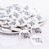front view of a pile of 25mm Nurse Life Print Flat Disc Acrylic Bubblegum Beads - 10 Count