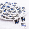 front view of a pile of 25mm Police Shield Print Flat Disc Acrylic Bubblegum Beads - 10 Count