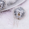 close up view of a pile of 31mm Rhinestone Dangle with White fur luxury acrylic beads
