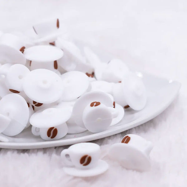front view of a pile of 3D Coffee Cup Silicone Focal Bead Accessory