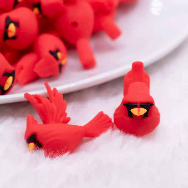 macro view of a pile of 3D Red Cardinal Silicone Focal Bead Accessory