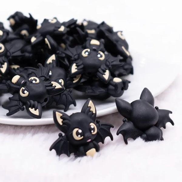 close up view of a pile of 3D Black Bat silicone focal bead