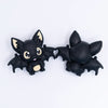 top view of a pile of 3D Black Bat silicone focal bead