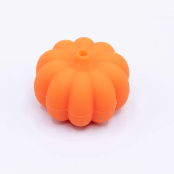 Macro view of a pile of 3D Pumpkin silicone focal bead