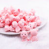 front view of a pile of 3D Pig silicone focal bead