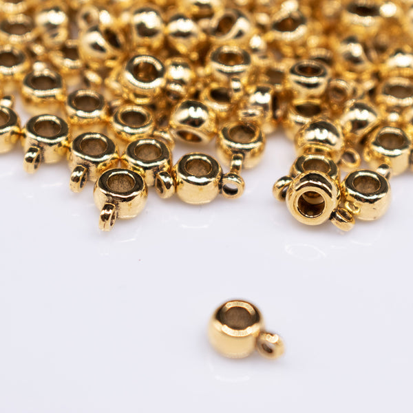 front view of a pile of Gold Spacer with Charm Mount - Set of 10