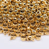 macro view of a pile of Gold Spacer with Charm Mount - Set of 10