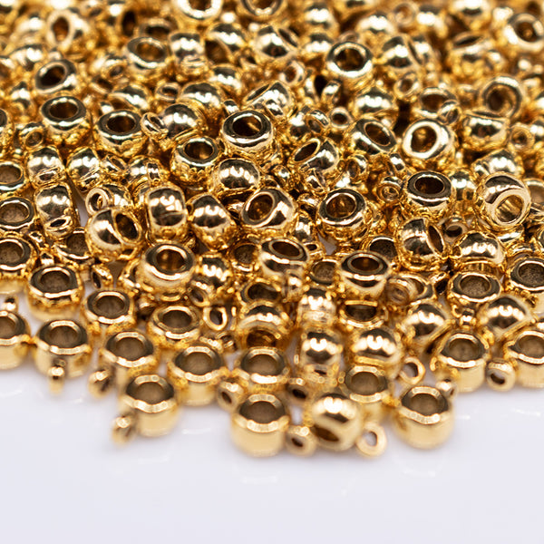 macro view of a pile of Gold Spacer with Charm Mount - Set of 10