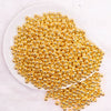top view of a pile of 6mm Gold Acrylic Spacer Beads