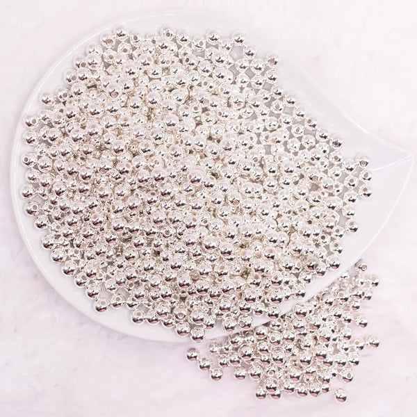 top view of a pile of 6mm Silver Acrylic Spacer Beads