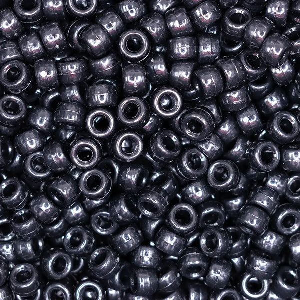 top view of a pile of black 6mm x 9mm Acrylic Pony Beads
