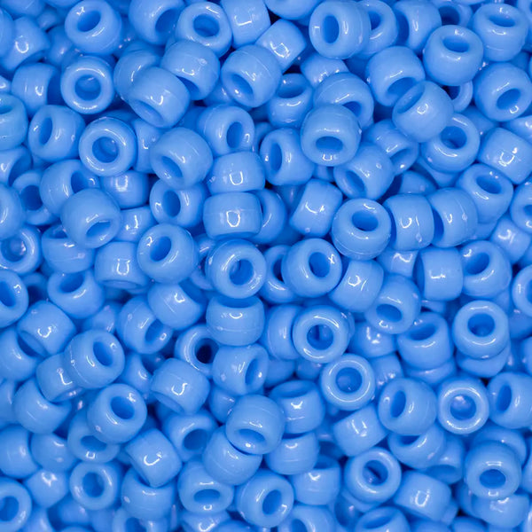 top view of a pile of blue 6mm x 9mm Acrylic Pony Beads