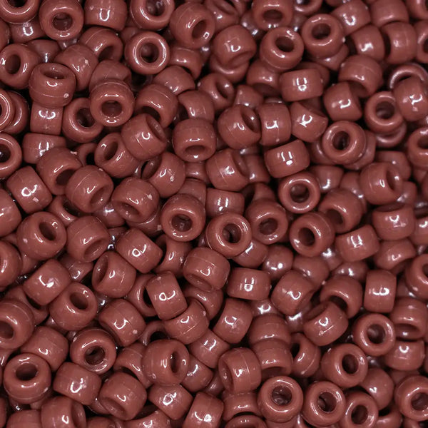 top view of a pile of brown 6mm x 9mm Acrylic Pony Beads