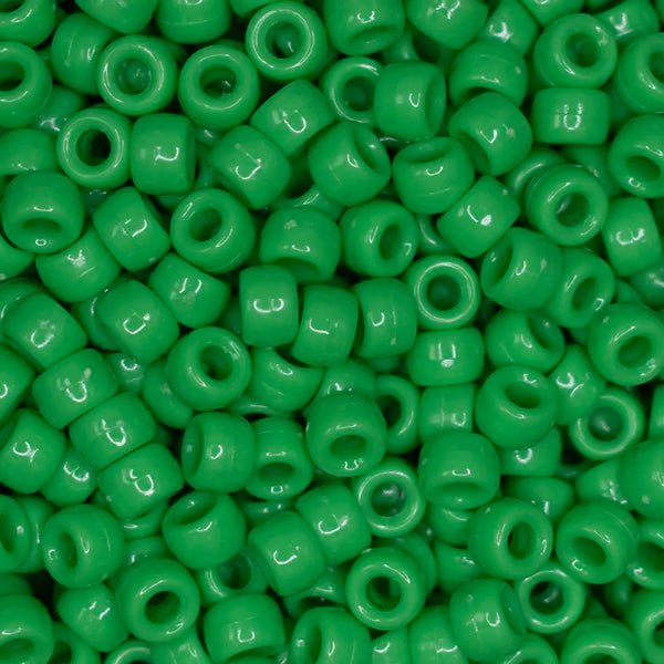 top view of a pile of green 6mm x 9mm Acrylic Pony Beads