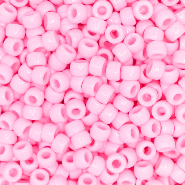 top view of a pile of pink 6mm x 9mm Acrylic Pony Beads