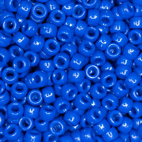 top view of a pile of royal blue 6mm x 9mm Acrylic Pony Beads