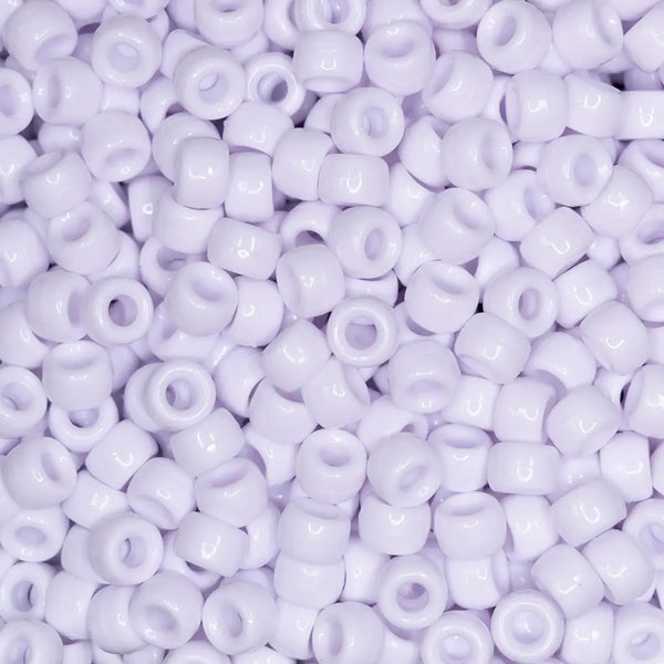 top view of a pile of white 6mm x 9mm Acrylic Pony Beads