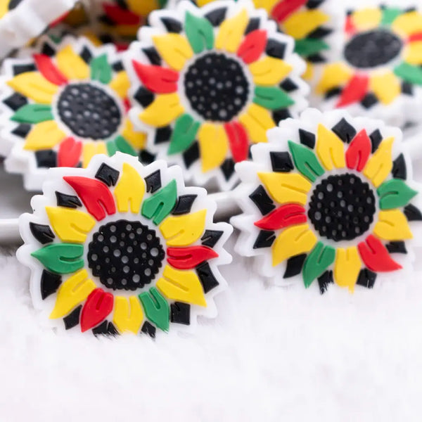 close up view of a pile of African Inspired Daisy Silicone Focal Bead Accessory