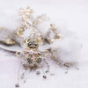 close up view of a pile of 48mm Gold Bear double sided acrylic bead with rhinestone and fur surround