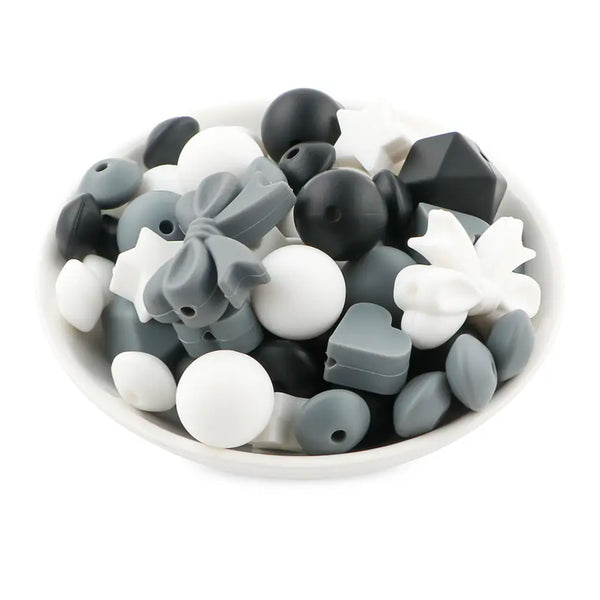 front view of a pile of Bow Silicone Variety Bead Pack with storage case- 63 Pieces