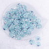 top view of a pile of 16mm Blue with Flower luxury acrylic beads