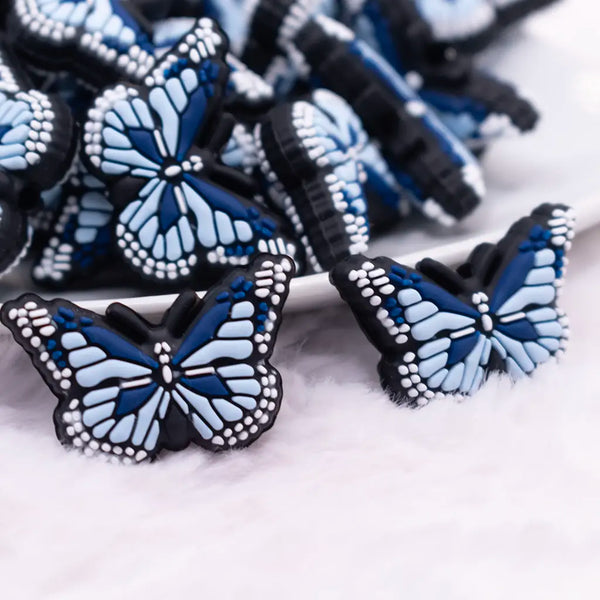 macro view of a pile of Blue Butterfly Silicone Focal Bead Accessory