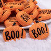 macro view of a pile of Boo Pumpkin Silicone Focal Bead Accessory