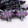 macro view of a pile of Butterfly Cross Silicone Focal Bead Accessory
