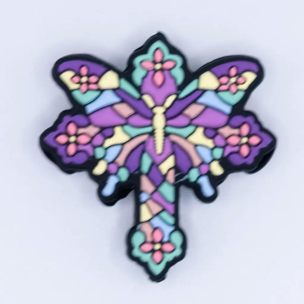 top view of a pile of Butterfly Cross Silicone Focal Bead Accessory