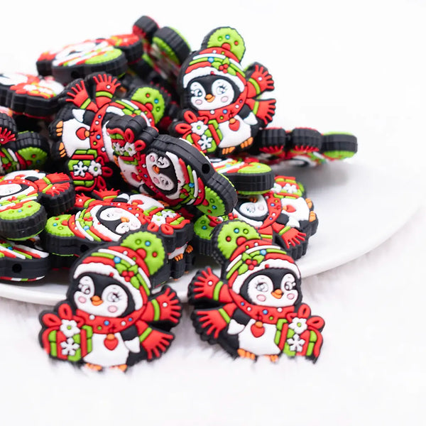 front view of a pile of Christmas Penguin Silicone Focal Bead Accessory