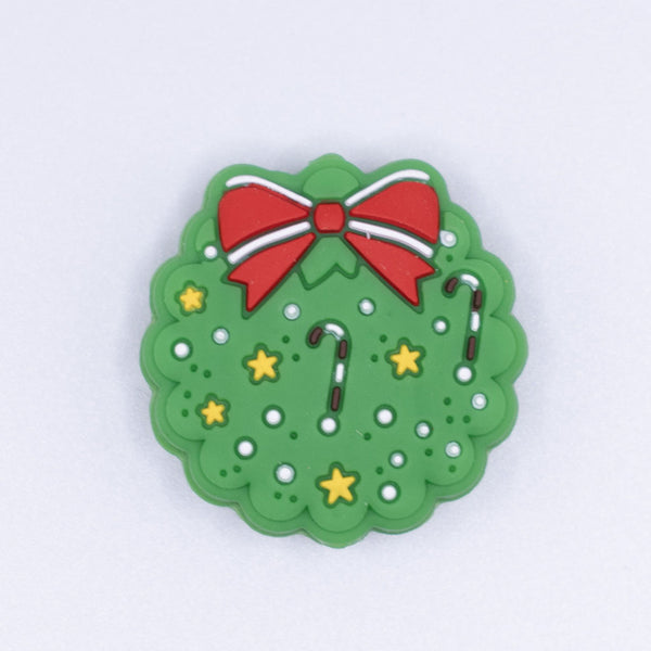 top view of a pile of Christmas Wreath Silicone Focal Bead Accessory