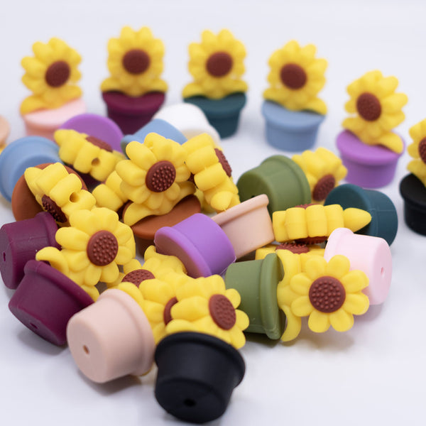 front view of a pile of Sunflower Pot Silicone Focal Beads Accessory