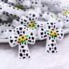 close up view of a pile of Cow Cross with Sunflower Silicone Focal Bead Accessory