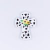top view of a pile of Cow Cross with Sunflower Silicone Focal Bead Accessory