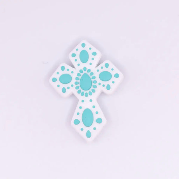 macro view of a pile of Cross with Teal print silicone focal bead