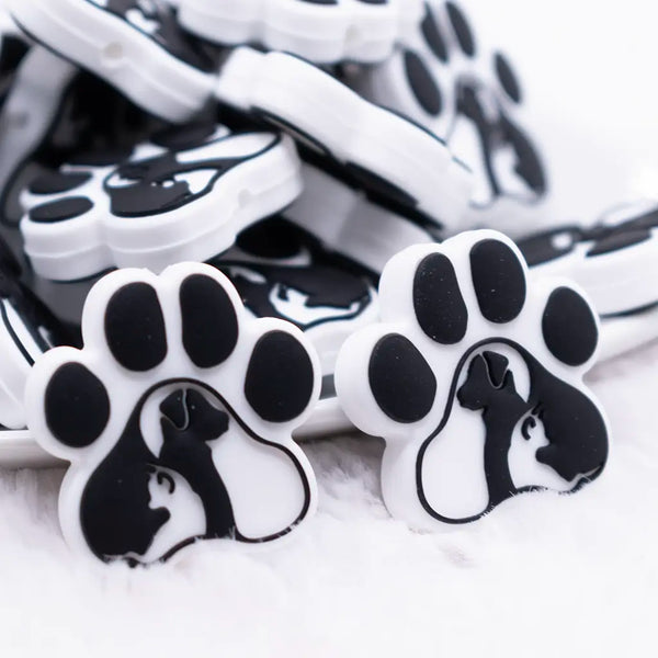 close up  view of a pile of Dog and Cat Paw Print Silicone Focal Bead Accessory