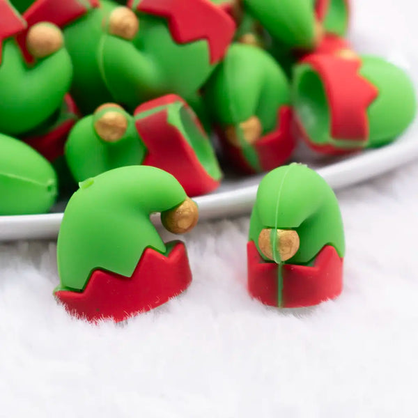 close up view of a pile of Elf Hat 3D Silicone Focal Bead Accessory