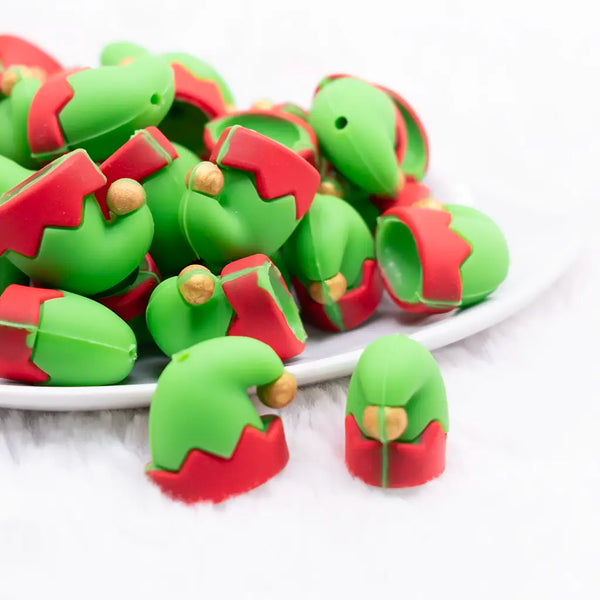 front view of a pile of Elf Hat 3D Silicone Focal Bead Accessory