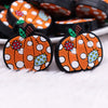 close up view of a pile of Fall Pumpkin Silicone Focal Bead Accessory - 27mm x 30mm
